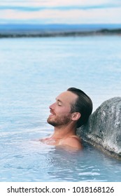 Wellness Spa Handsome Man Relaxing Enjoying Natural Geothermal Hot Spring In Outdoor Iceland Nature. Reykjavik Tourist Nordic Travel.