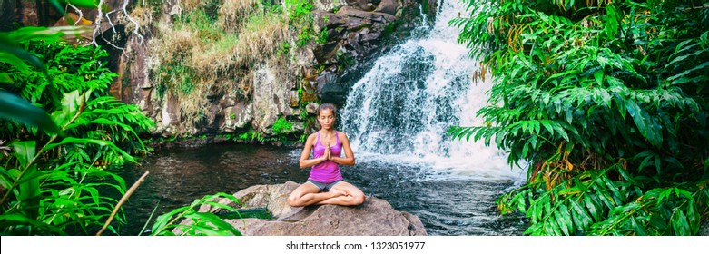 Wellness Yoga Woman Practicing Meditation In Nature By Watefall And Lush Forest. Banner Panorama Of Health And Fitness, Mindfulness Concept.