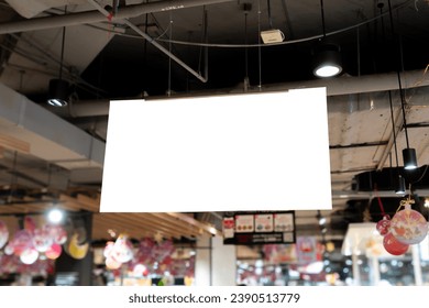 A well-positioned ceiling-mounted sign in a store, effectively guiding and informing shoppers about store offerings.