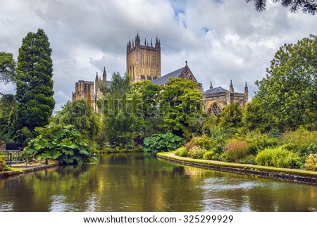 Wells Cathedral (Cathedral Church of Saint Andrew), Wells Abbey and park on sunny day, Somerset, England