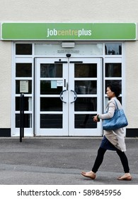 Wells, UK - August 30, 2014: People Walk Past A JobCentre Plus Unemployment Office On A City Centre Street. The Modern Welfare State In The UK Was Founded On The Beveridge Report Of 1942.