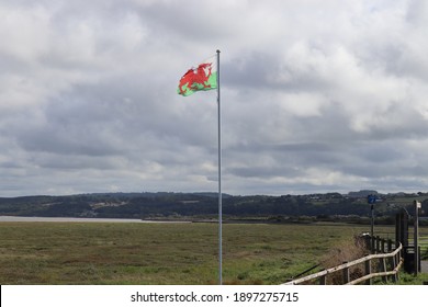 Welsh Flag Blowing In The Wind At Talacre, North Wales 