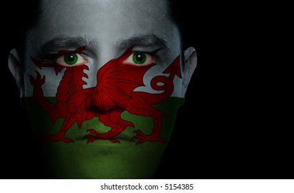 Welsh Flag Painted/projected Onto A Man's Face.