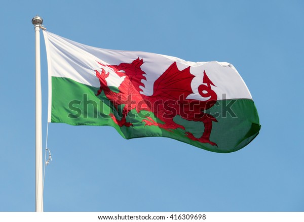 Welsh flag (Y\
Ddraig Goch) blowing in the\
wind.