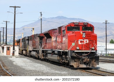 Wenatchee, WA, USA - August 25, 2021; A Canadian Pacific locomotive heads a line of engines from Norfolk Southern and BNSF at Wenatchee Washington