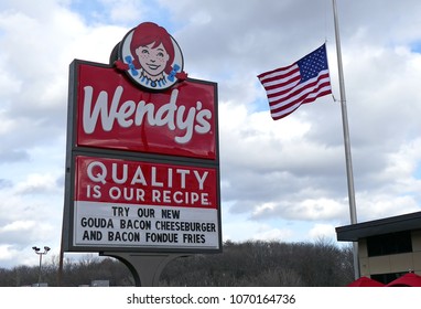 Wendy's Hamburger Restaurant Highway Entrance Sign, US American Flag, Lynnfield, Massachusetts USA - November 26, 2015