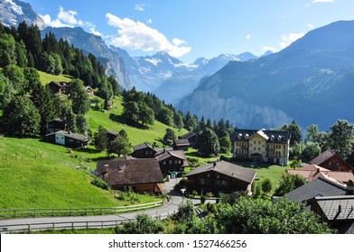 WENGEN, SWITZERLAND - September 4, 2019. The mountain village of Wengen with the Lauterbrunnen valley and Alpine peaks behind, Bernese Oberland, Switzerland - Shutterstock ID 1527466256