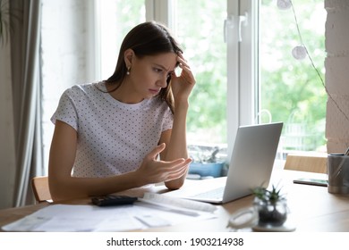 Went into debt. Annoyed young lady look on pc screen calculate too big sum of tax utility bills mortgage loan payment. Confused female self employed enterpreneur miss term to pay tax receive penalty