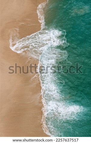 Similar – Aerial Drone View Of Blue Ocean Waves And Beautiful Sandy Beach Shore in Portugal