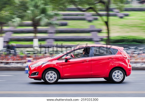 WENZHOU-CHINA-NOV. 19, 2014. Red Ford Focus on the\
street. Ford reported record sales in China in Jan. 2015. Sales of\
112,599 vehicles for Jan. is 19% increase while GM saw sales\
decline to start\
2015
