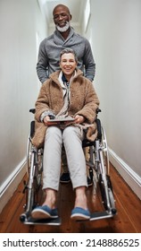Were all smiles this side. Full length shot of a senior man pushing his wheelchair-bound wife through the house.