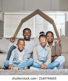 Were Always Protected. Shot Of A Young Family Relaxing Together At Home.