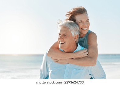 Were having a lovely day at the beach. Shot of a mature couple spending time together at the beach. - Powered by Shutterstock