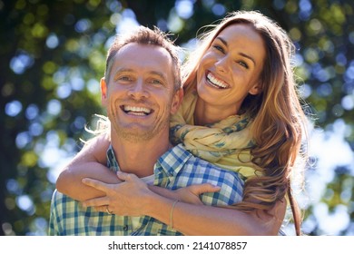 Were So In Love. Portrait Of An Affectionate Couple Outside In The Summer Sun.