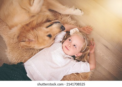 Were In This Together, Kid. An Adorable Little Girl With Her Dog At Home.