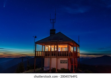 Werner Peak Fire Lookout Tower with NEOWISE comet in the Stillwater State Forest near Whitefish, Montana, USA