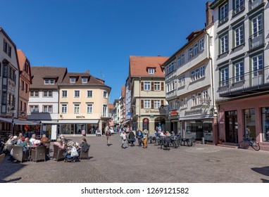 WERTHEIM, GERMANY - APR 6, 2018: people visit the pedestrian zone of the scenic medieval village of Wertheim i Bavaria, Germany.