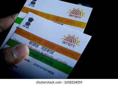 West Bengal, India, February 2020, Aadhaar Card Identity Of India Held In Hand On Black Background With Selective Focus