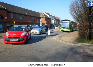 West Bridgford, Nottingham, UK 03 08 2022 Blonde Woman Crossing A Busy Road