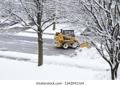 West Chester PA -March 1 2019 Small Truck Clearing Snow On A Street, Selective Focus