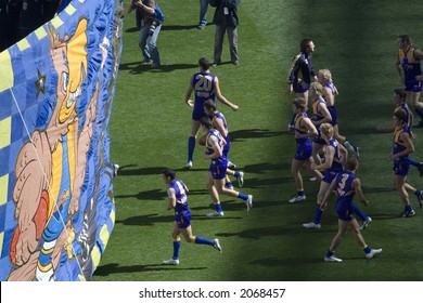 West Coast Eagles About To Burst Throught The Banner At The Afl Grand Final