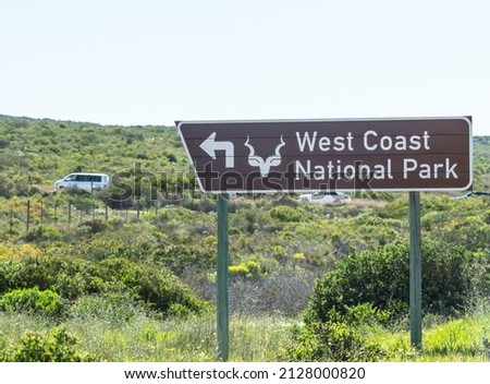West coast national park road sign with an arrow showing direction for turnoff concept travel and tourism Western Cape, South Africa