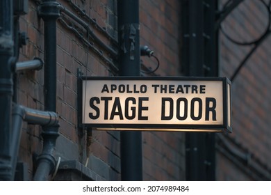 West End, London, United Kingdom - 14th November 2021 : Illuminated Stage Door Sign At The Apollo Theatre In Shaftesbury Avenue.