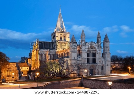 The west front of the Norman built Rochester Cathedral floodlit at night, Rochester, Kent, England, United Kingdom, Europe