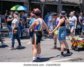 West Hollywood, CA - June 5, 2022: Couple Holding Hands At Pride Parade