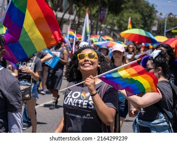 West Hollywood, CA - June 5, 2022: Supporter With Rainbow Flag At Pride Parade