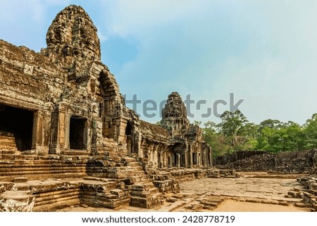 West inner gallery towers and four of the 216 carved faces at bayon temple in angkor thom walled city, angkor, unesco world heritage site, siem reap, cambodia, indochina, southeast asia, asia