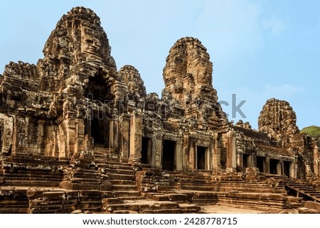 West inner gallery towers and seven of the 216 carved faces at bayon temple in angkor thom walled city, angkor, unesco world heritage site, siem reap, cambodia, indochina, southeast asia, asia