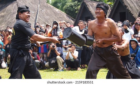 West Java, Indonesia - December 2, 2012 : A Magic Show That Shows A Man's Immunity By Not Being Able To Stick A Giant Nail