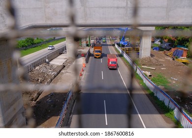 West Java, Indonesia - November, 2020: Infrastructure development in Bandung City to build toll road and railway construction. The public facility also priority in Indonesia amid the covid19 pandemic.