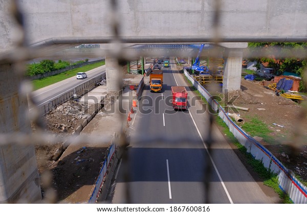 West Java, Indonesia - November, 2020:\
Infrastructure development in Bandung City to build toll road and\
railway construction. The public facility also priority in\
Indonesia amid the covid19\
pandemic.