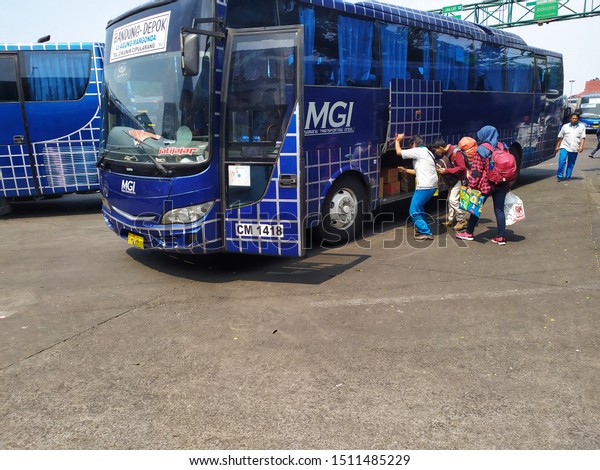 WEST JAVA, INDONESIA - SEPTEMBER 22, 2019: A bus\
is waiting for passengers at Terminal Leuwi Panjang, a bus terminal\
in Bandung