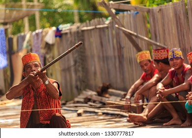 West Kalimantan / Indonesia - December 11, 2015 : 
Spectacular Borneo Sumpit, Blowgun / Blowpipe Hunting Spear. Traditional Weapon Consisting Of A Small Wooden Tube For Firing Light Projectiles /dart