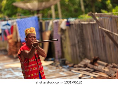 West Kalimantan / Indonesia - December 11, 2015 : 
Spectacular Borneo Sumpit, Blowgun / Blowpipe Hunting Spear. Traditional Weapon Consisting Of A Small Wooden Tube For Firing Light Projectiles / Dart