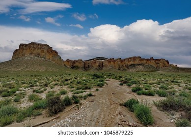 West Kazakhstan. In The Boundless Steppe There Is A Lonely Mountain Complex Shirkala, Which From A Distance Looks Like A Yurt.