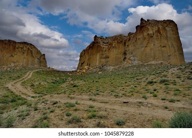 West Kazakhstan. In The Boundless Steppe There Is A Lonely Mountain Complex Shirkala, Which From A Distance Looks Like A Yurt.