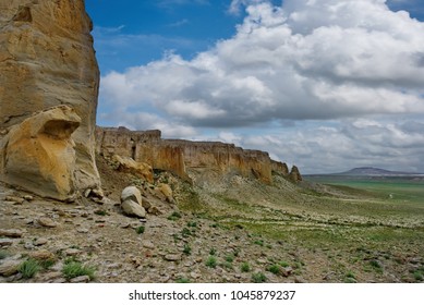 West Kazakhstan. In The Boundless Steppe There Is A Lonely Mountain Complex Shirkala, Which From A Distance Looks Like A Yurt.