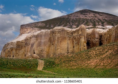 West Kazakhstan. In The Boundless Steppe There Is A Lonely Mountain Complex Shirkala, Which From A Distance Looks Like A Yurt.