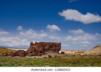 West Kazakhstan. In The Boundless Steppe There Is A Lonely Mountain Complex Shirkala, Which From A Distance Looks Like A Yurt.