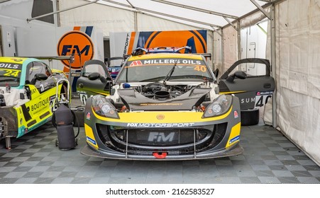 West Kingsdown, Kent, UK – May 15 2022. Ginetta GT4 Race Car Being Prepared And Tuned In A Pitlane Garage For A Championship Race