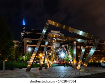 West Loop, Chicago-May 17, 2019: Night Scene In Chicago West Loop Neighborhood With Fountain Plaza,  Landmark Tower And Moving Clouds. Travel In Illinois.