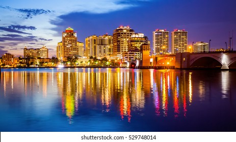 West Palm Beach, Florida Skyline And City Lights As Night Falls