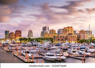 West Palm Beach, Florida, USA downtown skyline on the Intracoastal Waterway at dusk.