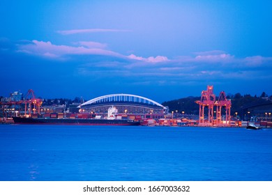 West Seattle Bridge And Port Cranes Over Elliot Bay At Evening Time, Washington, USA