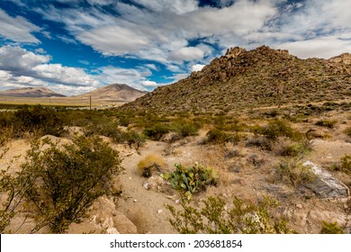 West Texas Landscape Of Desert Area With Hills And Blue Sky With Clouds.