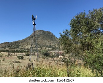 West Texas Windmill Under Blue Skies